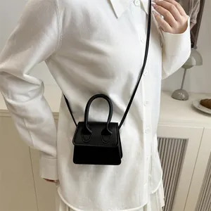 Stylish mini black crossbody handbag for women featuring a minimalist square design