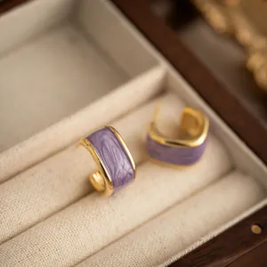 French vintage purple enamel hoop earrings with gold-plated trim in a jewelry box