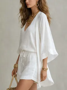 Elegant three-piece white cotton linen leisure set with cardigan, tank top and shorts.