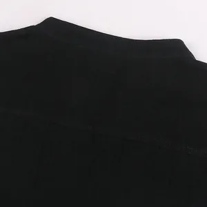 Close-up of black medieval Renaissance shirt showing collar and back yoke fabric texture.