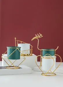 Nordic minimalist gold iron frame ceramic flower pots in various geometric shapes.