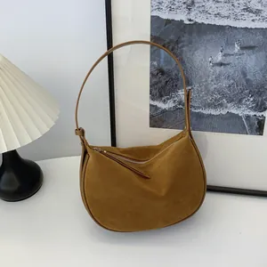 Brown suede matte underarm hobo bag for women with a minimalist design and soft texture