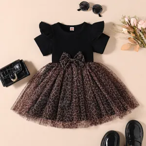 Girl's stylish black ribbed dress with leopard print tulle skirt and bow detail