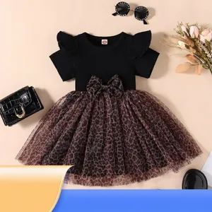 Girl's stylish black ribbed dress with leopard print tulle skirt and bow detail