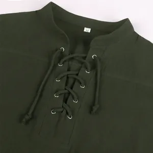 Close-up of medieval Renaissance men's shirt with olive green lace-up collar detail