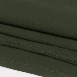 Close-up detail of dark green fabric and stitching for men's medieval gothic shirt