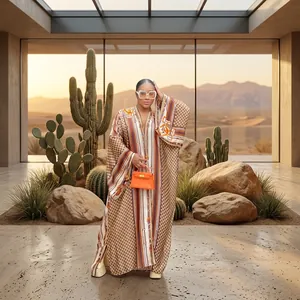 Elegant bohemian printed kimono maxi dress with wide long sleeves shown on model outdoors