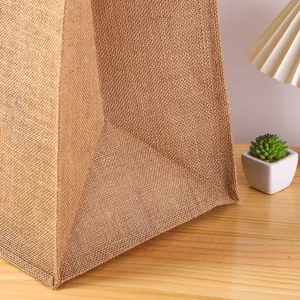 Detailed macro view of the bottom of a durable waterproof laminated jute tote bag