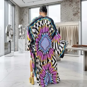 Detailed back view of a long bohemian printed kimono cardigan with colorful starburst