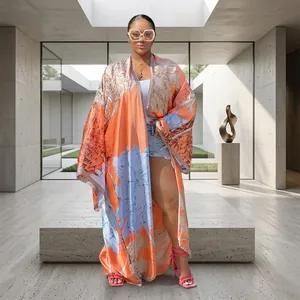 Long orange floral printed kimono cardigan for women with a loose bohemian style fit