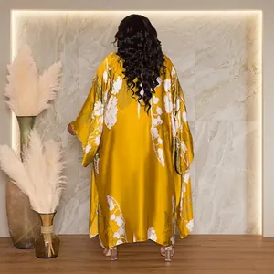 Back view of a stylish loose mustard yellow floral print long kimono robe for women