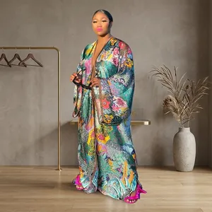 Detailed view of women's loose long-sleeved kimono cardigan with tropical print