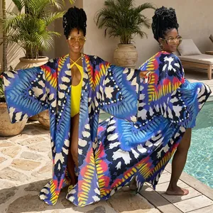 Detailed view showing vibrant bohemian geometric print on loose-fit long sleeve kimono
