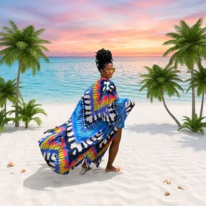 Elegant model wearing long loose printed kimono cardigan in a tropical outdoor setting