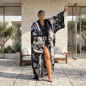 Detailed view of women's loose printed long kimono robe with abstract art patterns