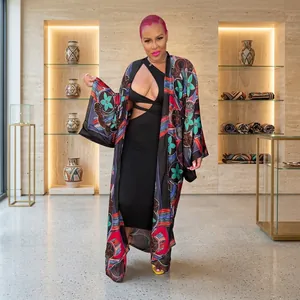 Model wearing a long-sleeved floral print casual kimono cardigan with a black dress