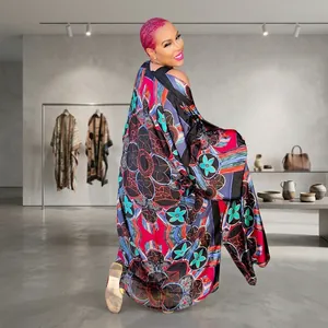 Full-length back view of a vibrant floral printed loose long-sleeved kimono duster coat