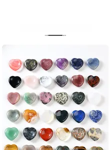 A diverse collection of 30mm natural heart-shaped thumb stones in various colors and textures