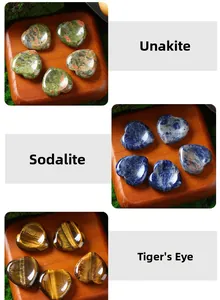 Heart-shaped natural crystals including Unakite, Sodalite, and Tiger's-eye worry stones