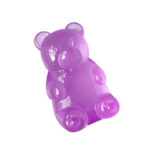Close-up view of a translucent purple bear-shaped squishy stress relief toy on white