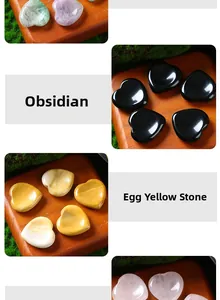 Macro detail view of 30mm heart-shaped obsidian and yellow crystal massage stones
