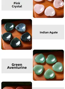 Detail view of 30mm heart-shaped natural massage stones in crystal, agate, and green aventurine.