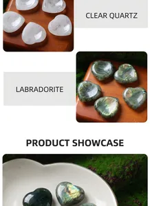 Detailed view of 30mm heart-shaped natural white crystal and labradorite massage stones.