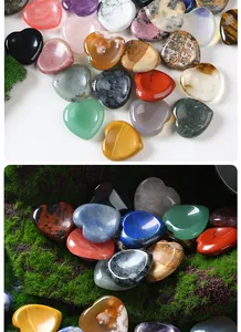 Close-up of colorful 30mm heart-shaped natural crystal and agate worry stones