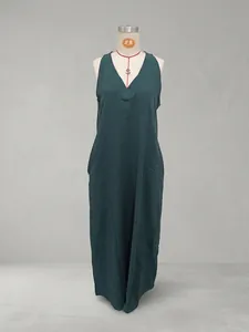 Casual dark green sleeveless cotton-linen maxi dress with side pockets on mannequin