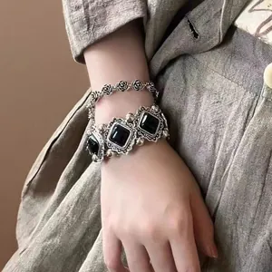 Elegant vintage silver tone bracelet with black square gemstones and rose chain