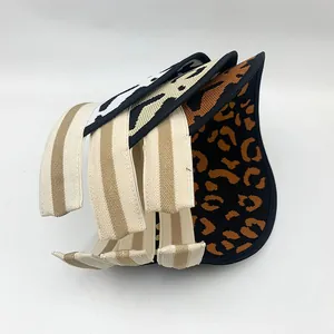 Detailed view of leopard and zebra print sun visors with elastic bands for women