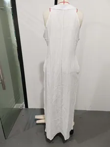 Back view of a casual white sleeveless cotton linen maxi dress shown on a mannequin.