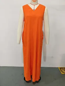 Detailed front view of an orange sleeveless cotton linen maxi dress with pockets on a mannequin