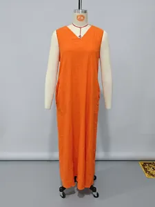 Detailed front view of an orange sleeveless cotton linen maxi dress with pockets on a mannequin