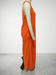 Detailed side view of a vibrant orange sleeveless cotton linen maxi dress with pockets