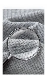 Close-up macro view of gray ribbed fabric texture for slim fit cotton T-shirt