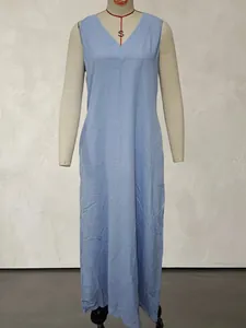 Full-length view of a casual blue sleeveless cotton linen maxi dress on a mannequin.
