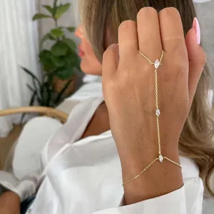 Vintage gold chain slave bracelet featuring marquise-cut crystals on model's hand
