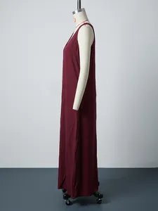 Side view of a burgundy sleeveless loose cotton linen maxi dress on white mannequin