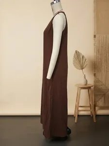 Side view of a casual brown sleeveless cotton linen maxi dress shown on a white mannequin