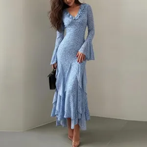 Close-up detail of light blue floral maxi dress with ruffled V-neck and tiered skirt.