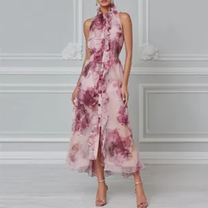 Elegant sleeveless pink floral print maxi dress with ruffles detail on a female model
