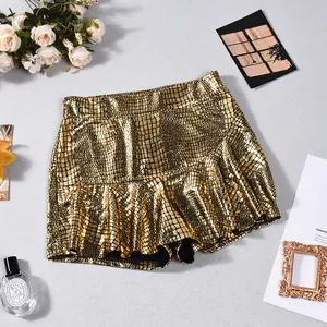 Flat lay of a stylish metallic gold faux leather skort with crocodile pattern texture