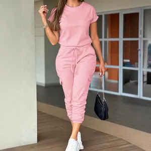 Stylish women's pink casual short-sleeve cargo jumpsuit with drawstring waist and cuffs