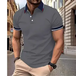 Classic men's casual grey polo shirt with navy contrast collar and striped sleeve cuffs.