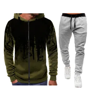 Detailed view of men's army green splatter print zip-up hoodie and gray joggers