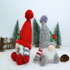 Two handmade Christmas gnomes with knitted hats and long white beards