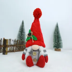 Detailed view of a festive Christmas gnome doll with red knit hat and plush white beard