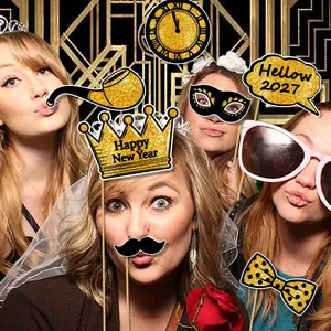 2027 New Year party photo booth props set with glitter gold crowns and speech bubbles