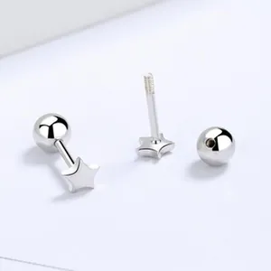 Close-up detail of minimalist 925 sterling silver star-shaped screw-back stud earrings